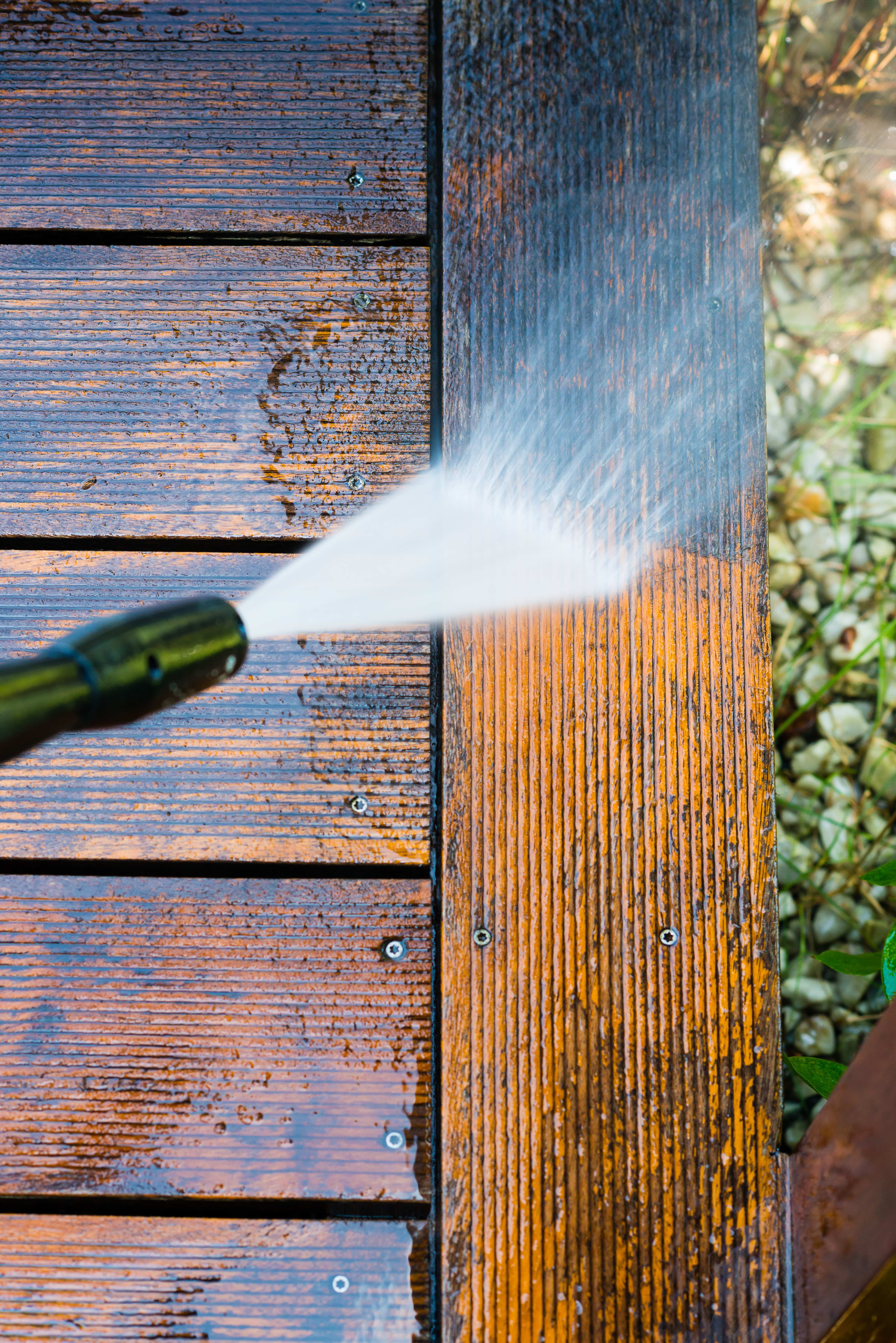 cleaning terrace with a pressure washer